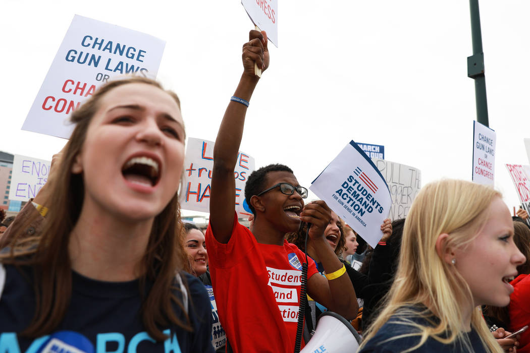 Markell Merritt, a 15-year-old student from Legacy High School, center, participates in the Las Vegas March for Our Lives event, which started at Symphony Park and ended in Las Vegas City Hall, on ...