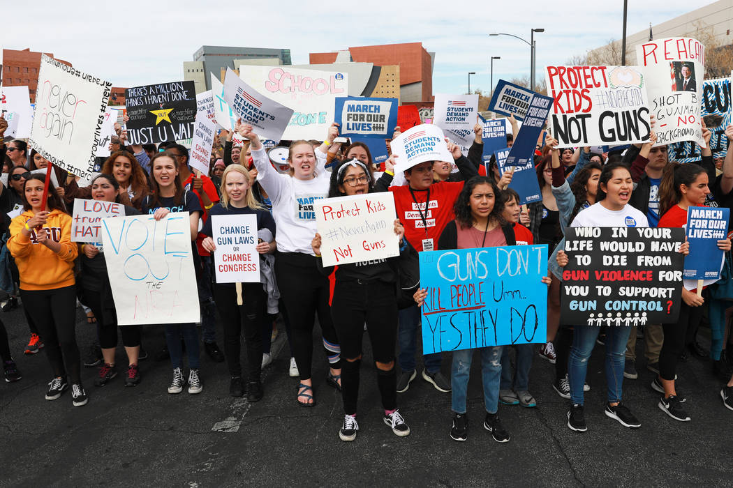 Attendees participate in the Las Vegas March for Our Lives event, which started at Symphony Park and ended in Las Vegas City Hall, on Saturday, March 24, 2018. Andrea Cornejo Las Vegas Review-Jour ...