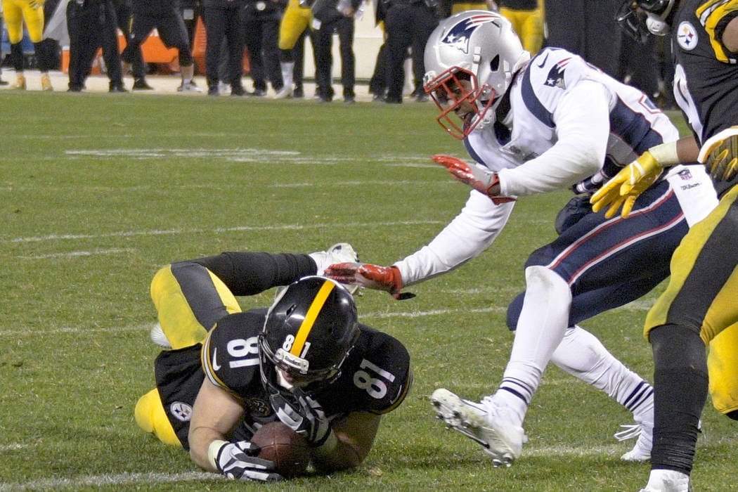 In this Sunday, Dec. 17, 2017, file photo, Pittsburgh Steelers tight end Jesse James (81) loses his grip on the football after crossing the goal line on a pass play against the New England Patriot ...