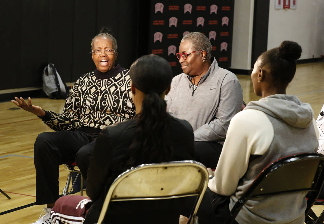 Women's basketball pioneers Musiette McKinney, left, and Cardte Hicks, chat with the Las Vegas Aces players Moriah Jefferson, second left, and Sequoia Holmes at UNLV's basketball practice court on ...