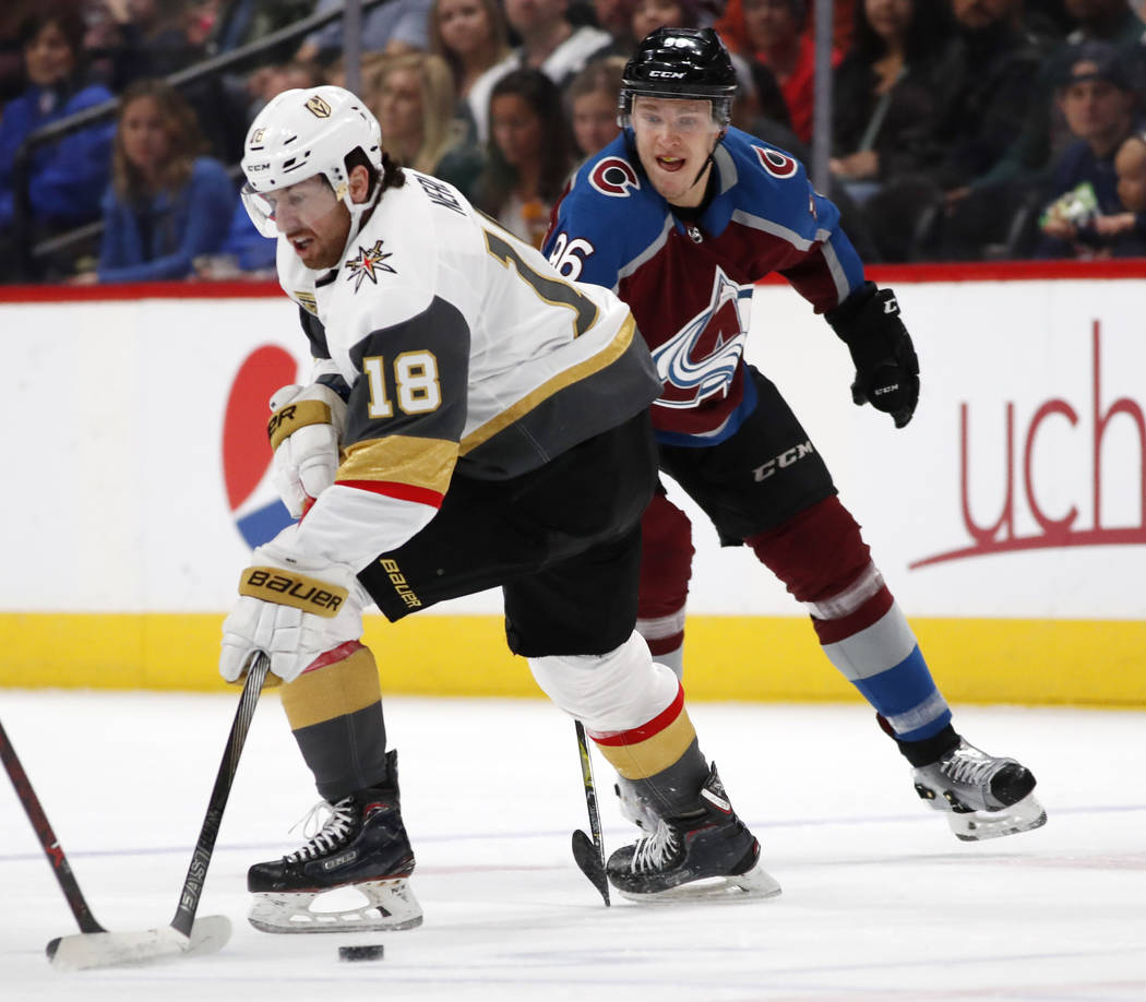 Vegas Golden Knights left wing James Neal, front, loses control of the puck as Colorado Avalanche right wing Mikko Rantanen defends in the first period of an NHL hockey game Saturday, March 24, 20 ...