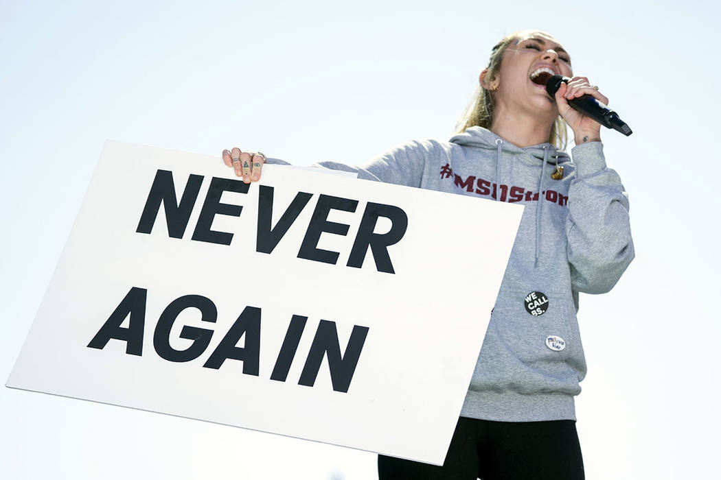 Miley Cyrus performs "The Climb" during the "March for Our Lives" rally in support of gun control in Washington, Saturday, March 24, 2018. (AP Photo/Andrew Harnik)