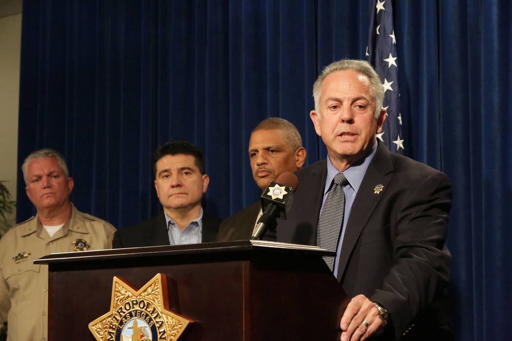 During a press conference at Las Vegas Metropolitan Police Department Headquarters on Monday, March 25, 2018, Sheriff Joe Lombardo, right, stands with Deputy Chief Christopher Darcy, left, Lieuten ...