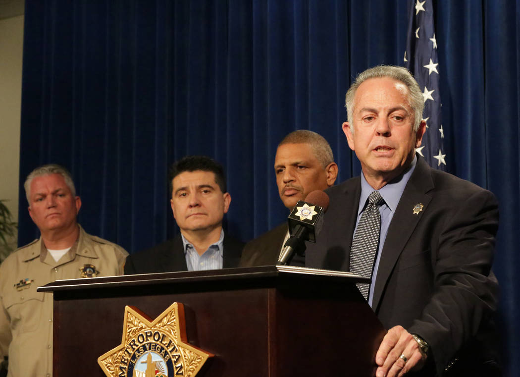 During a press conference at Las Vegas Metropolitan Police Department Headquarters on Monday, March 25, 2018, Sheriff Joe Lombardo, right, stands with Deputy Chief Christopher Darcy, left, Lieuten ...