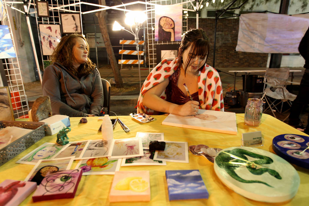 Artist Lexi Garza, right, works in her booth with her mother Heather Garza during First Friday in downtown Las Vegas' arts district Friday, March 2, 2018. K.M. Cannon Las Vegas Review-Journal @KMC ...