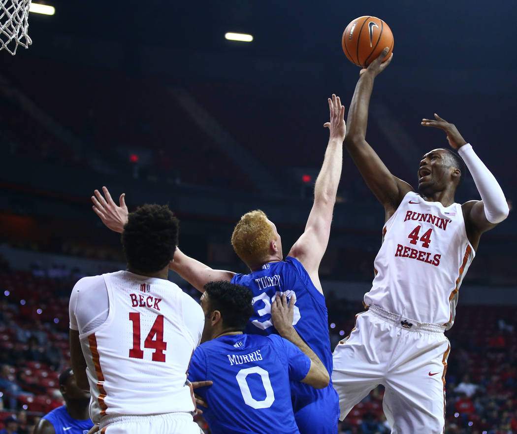 UNLV Rebels forward Brandon McCoy (44) shoots over Air Force Falcons center Frank Toohey (33) and guard Caleb Morris (0) during a basketball game at the Thomas & Mack Arena in Las Vegas on Wed ...