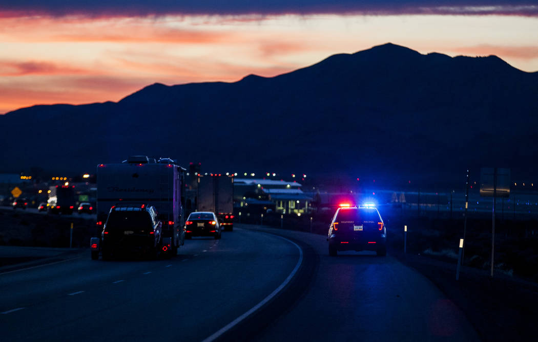 Nevada Highway Patrol stands by as U.S. Highway 95 is reopened near Creech Air Force Base in Indian Springs, after a suspicious piece of equipment on a truck caused the highway to be shut down in  ...