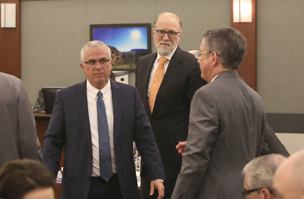 Mark Ferrario, left, a lawyer for Elaine Wynn, and Todd Bice, center, a lawyer for Steve Wynn, appear in court at the Regional Justice Center on Tuesday, March 27, 2018, in Las Vegas. Bizuayehu Te ...