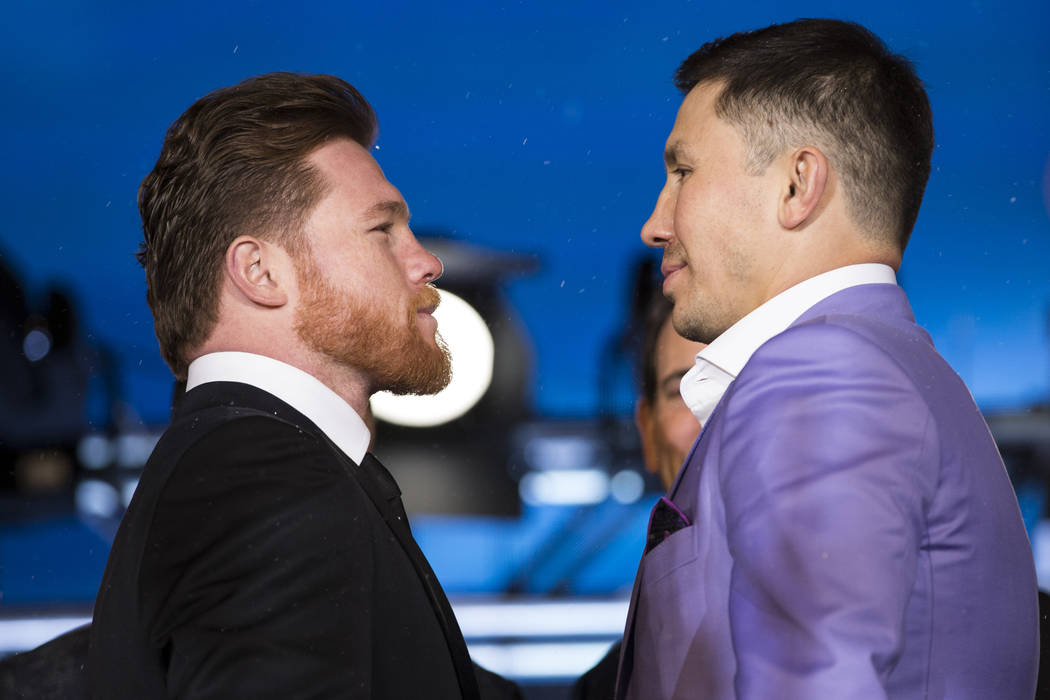 Boxers Saul "Canelo" Alvarez, left, and Gennady Golovkin, right, during a press conference for their upcoming fight at Microsoft Square in Los Angeles, Calif., Tuesday, Feb. 27, 2018. Er ...