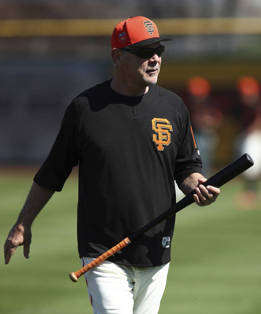 San Francisco Giants manager Bruce Bochy oversees a practice prior to a spring training baseball game against the Arizona Diamondbacks on Tuesday, Feb. 27, 2018, in Scottsdale, Ariz. (AP Photo/Ben ...