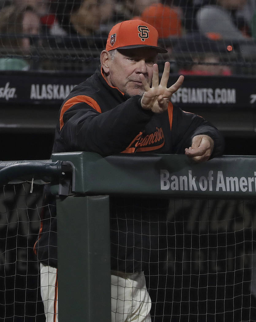 San Francisco Giants manager Bruce Bochy gestures toward the plate during a spring baseball game between the Giants and the Oakland Athletics in San Francisco, Tuesday, March 27, 2018. (AP Photo/J ...