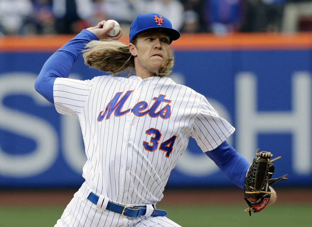 New York Mets' Noah Syndergaard (34) delivers a pitch during the first inning of a baseball game against the St. Louis Cardinals Thursday, March 29, 2018, in New York. (AP Photo/Frank Franklin II)