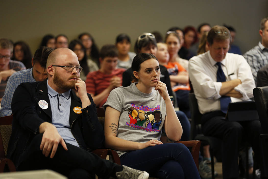 Wesley Juhl, 32, left, and Cassie Charles, 20, attend a hearing on proposed gender diverse regulations at the Department of Education's board room in Las Vegas on Friday, March 30, 2018. The State ...
