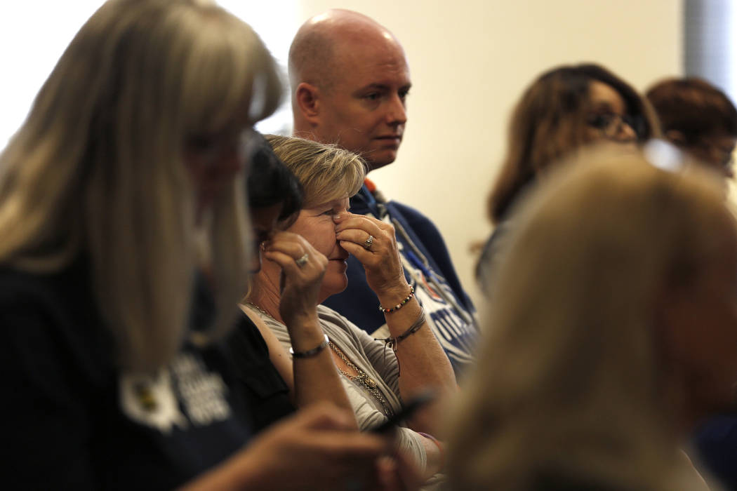 Attendees react to a statement made during a hearing on proposed gender diverse regulations at the Department of Education's board room in Las Vegas on Friday, March 30, 2018. The State Department ...
