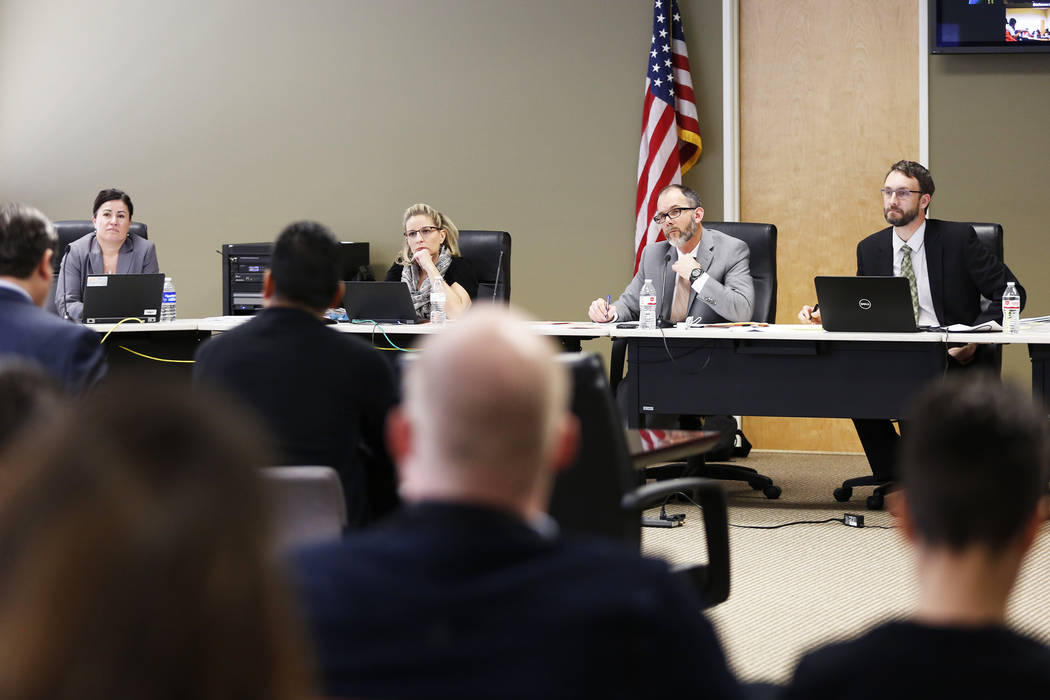 Members of the Nevada Department of Education listen to speakers during a hearing on proposed gender diverse regulations at the Department of Education's board room in Las Vegas on Friday, March 3 ...