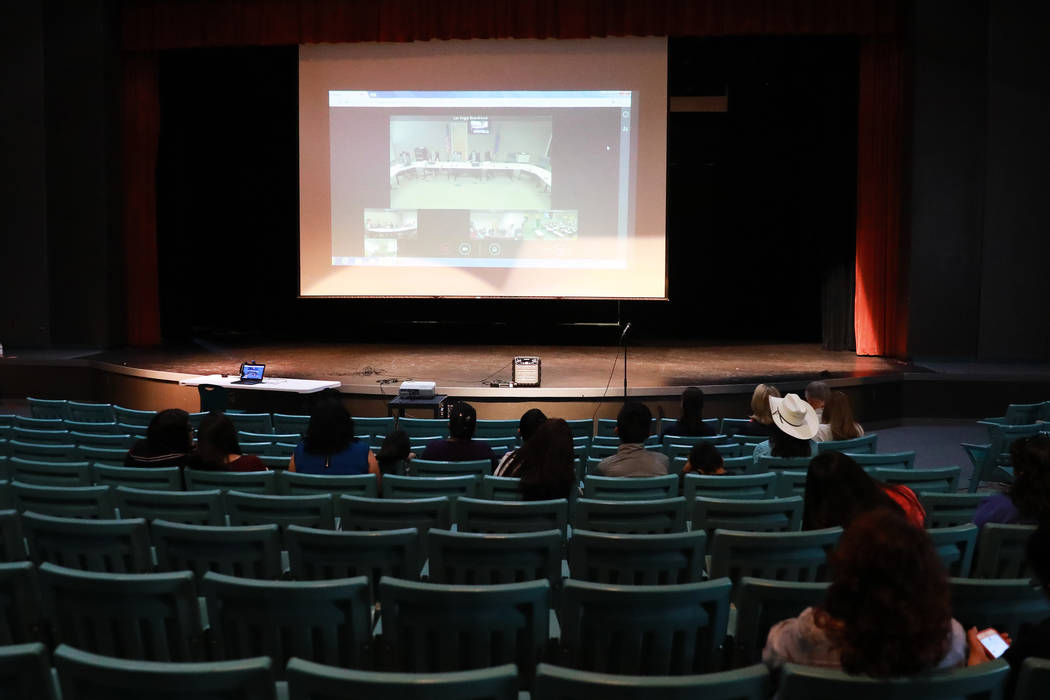 Attendees watch a hearing regarding gender diverse regulations, which took place at the Department of Education's board room, at the Silverado High School Auditorium in Las Vegas on Friday, March  ...