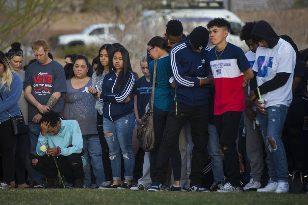 Attendees during a candlelight vigil at Knickerbocker Park in Las Vegas Friday, March 30, 2018 for Centennial High School students Albert ÒA.J.Ó Rossi, Dylan Mack and Brooke Hawley, who  ...