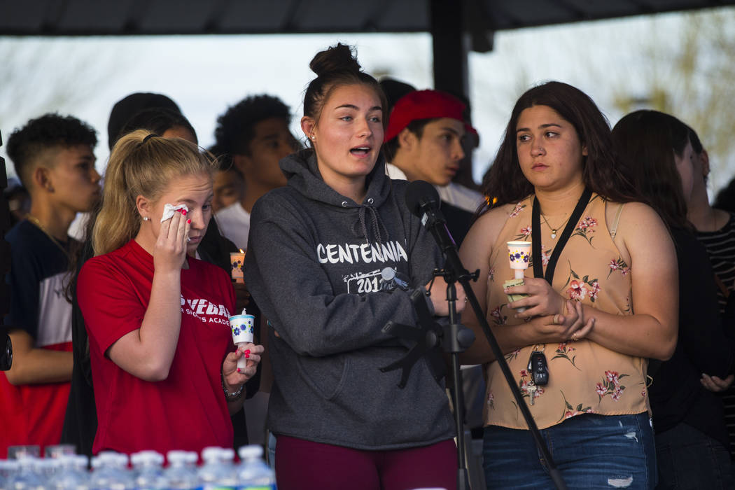 Addison Riddle, center, talks about the loss of her friend Brooke Hawley during a candlelight vigil at Knickerbocker Park in Las Vegas Friday, March 30, 2018. Brooke Hawley, along with fellow Cent ...