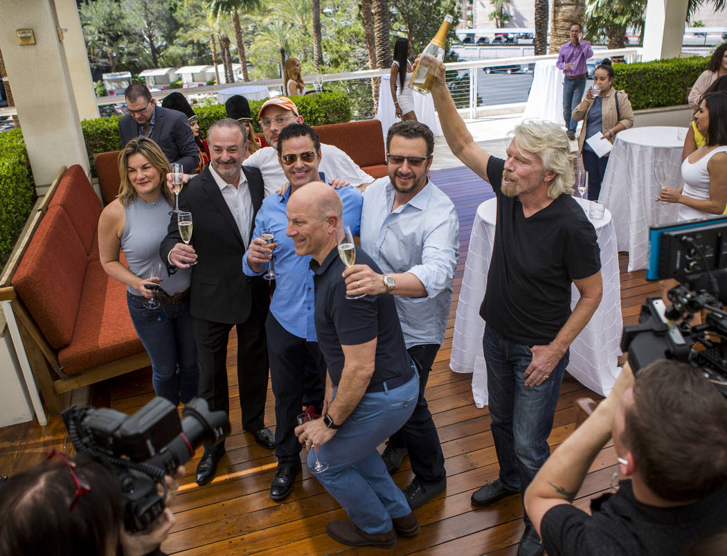 Virgin Group Founder Sir Richard Branson, right, Partner and Property CEO Richard ÒBozÓ Bosworth, second from left, and Virgin Hotels CEO Raul Leal, third from left, take a group photo w ...