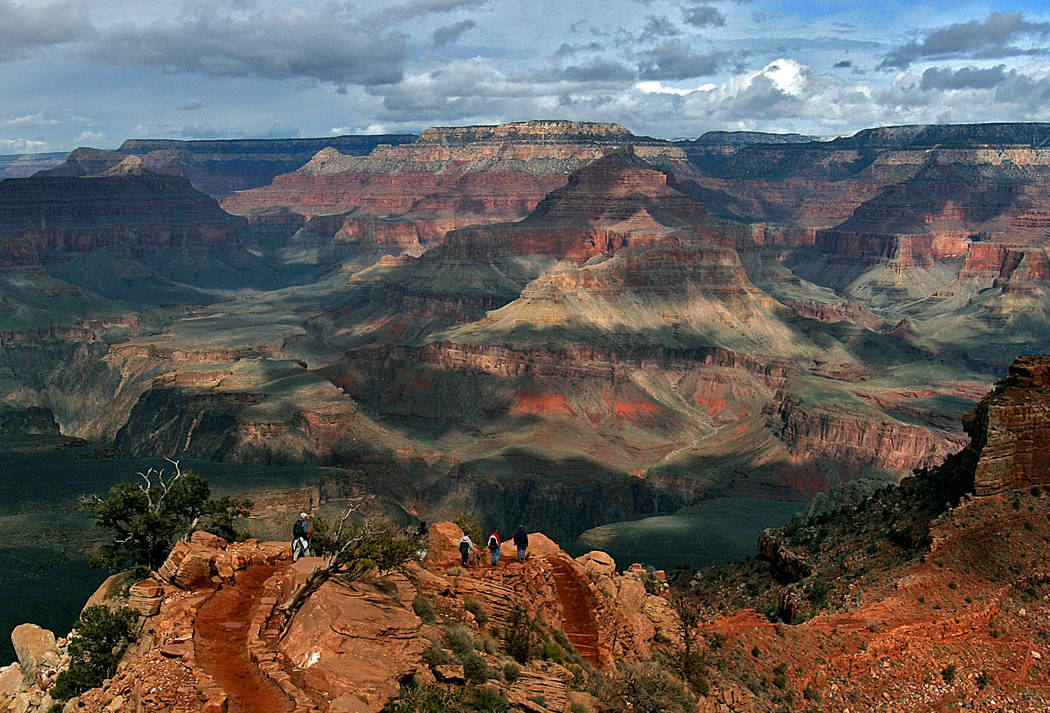 Tourists hike along the South Rim of the Grand Canyon in Grand Canyon, Ariz., in 2005. (AP Photo/Rick Hossman, File)