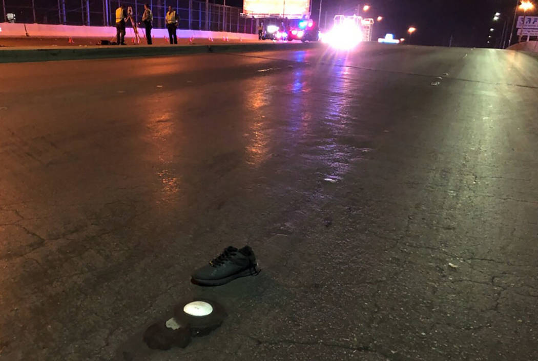 Nevada Highway Patrol troopers investigate the scene of a deadly crash in the eastbound lanes of Sahara Avenue at Industrial Road on Saturday night in Las Vegas. (NHP