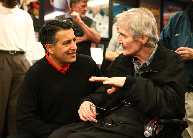 Gov. Brian Sandoval, left, speaks with former NFL quarterback David Humm at the rededication ceremony of the new Southern Nevada Sports Hall of Fame location at Findlay Toyota, 7733 Eastgate Road  ...