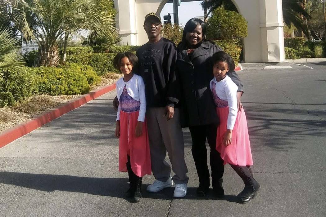 Joseph Whacks, his wife, Ghowanda, and their twin girls, seen around Christmas 2017, pose outside the Tuscany Hotel and Casino where the Kline Fund of Summerlin put them up after the family became ...