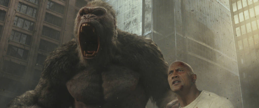 Photo Credit: Courtesy of Warner Bros. Pictures Caption: (L-R) JASON LILES as George and DWAYNE JOHNSON as Davis Okoye in New Line Cinema's and ASAP Entertainment's action adventure "RAMPAGE ...
