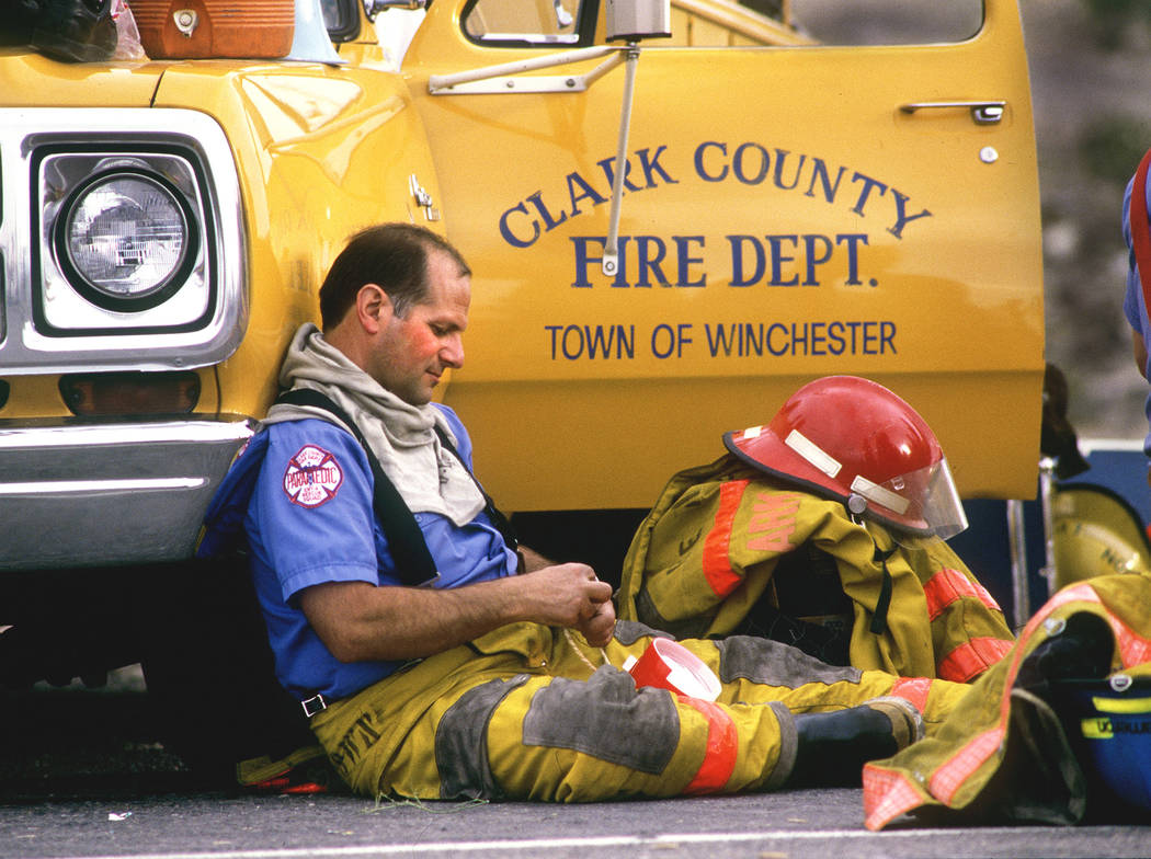 A paramedic relaxes in the command post after a series of explosions at the PEPCON plant on May 4, 1988. The plant manufactured rocket fuel. (Jeff Scheidl/Las Vegas Review-Journal)