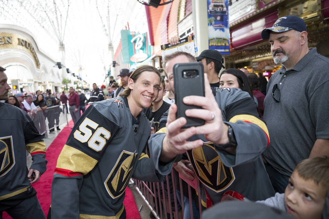 Vegas Golden Knights left wing Erik Haula (56) poses with fans during the team's first fan fest at the Fremont Street Experience in downtown Las Vegas on Sunday, Jan. 14, 2018. Richard Brian Las V ...
