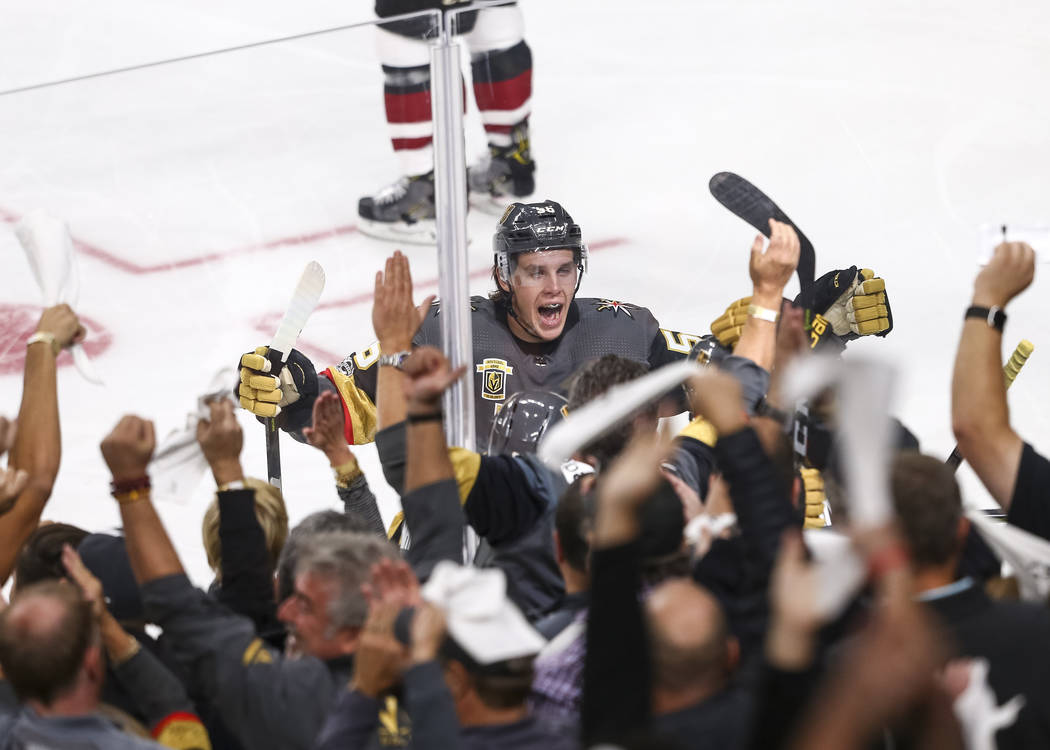 Vegas Golden Knights left wing Erik Haula (56) celebrates with fans after Knights defenseman Deryk Engelland (5) scored a goal during the first period of an NHL hockey game between the Vegas Golde ...