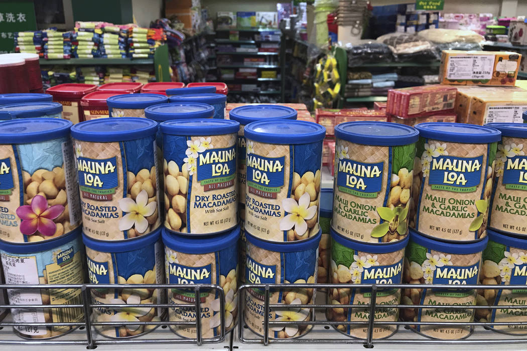 Imported nuts from the United States are displayed for sale at a supermarket in Beijing, Monday, April 2, 2018. China raised import duties on U.S. pork, fruit and other products Monday in an escal ...