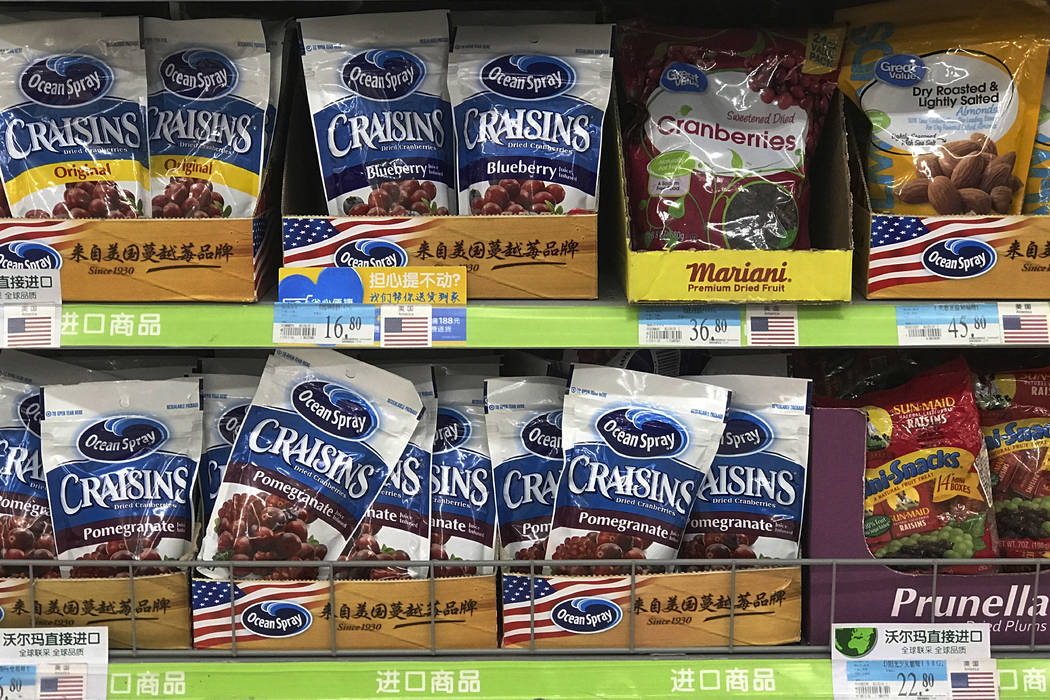 Imported raisins and nuts from the United States are displayed on sale at a supermarket in Beijing, Monday, April 2, 2018.  China raised import duties on a $3 billion list of U.S. pork, fruit and  ...