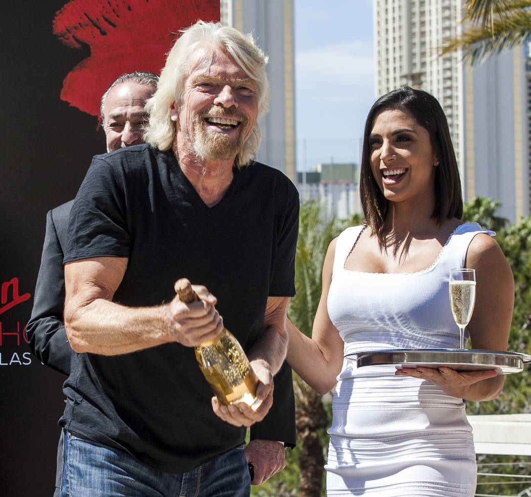 Virgin Group Founder Sir Richard Branson prepares for a champagne toast at a press conference at the Hard Rock Hotel in Las Vegas on Friday, March 30, 2018.  Patrick Connolly Las Vegas Review-Jour ...