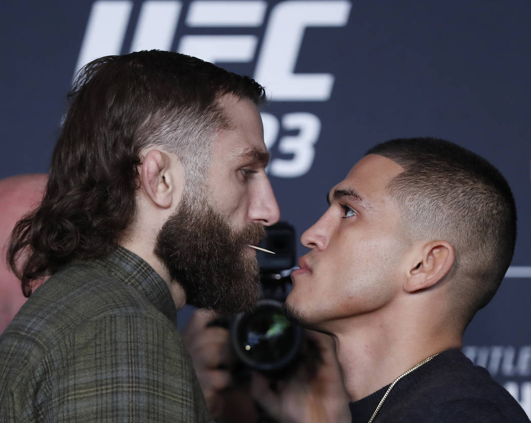 Michael Chiesa, left, poses for photographers with Anthony Pettis on Thursday, April 5, 2018, at UFC 223's media day in New York, to promote a bout scheduled for Saturday. Chiesa's fight status wa ...