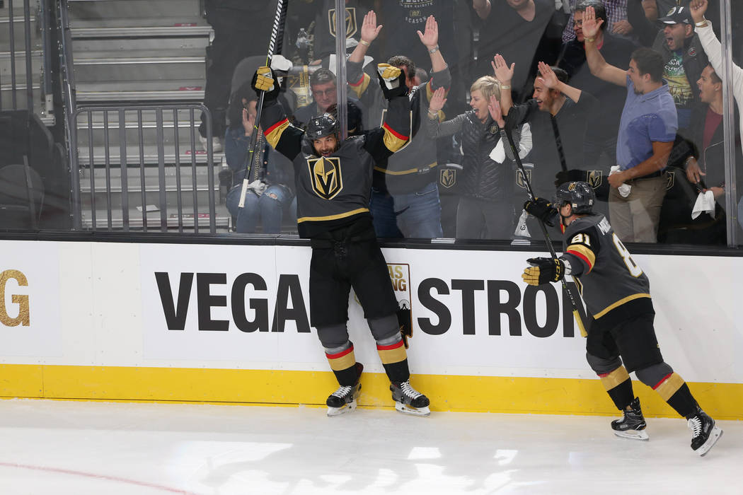 Vegas Golden Knights defenseman Deryk Engelland (5) raises his arms after his score in the NHL season home opener against the Arizona Coyotes at T-Mobile Arena in Las Vegas, Tuesday, Oct. 10, 2017 ...