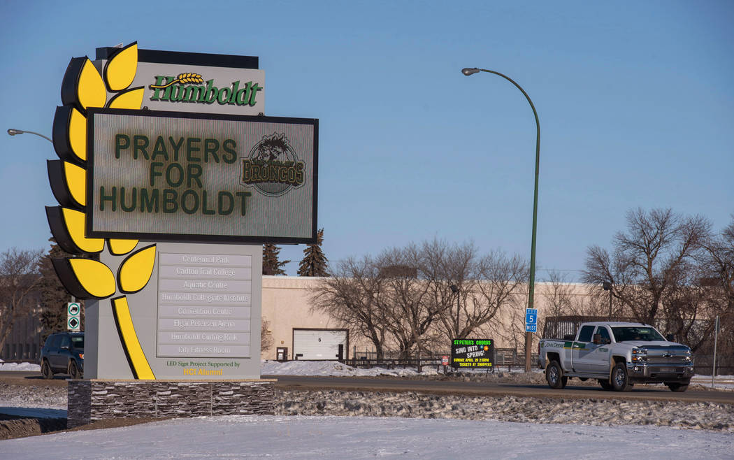 A truck drives by the welcome sign honoring the members of the Humboldt Broncos hockey team in Humboldt, Saskatchewan, Canada, Saturday, April 7, 2018. Canadian police said early Saturday that se ...