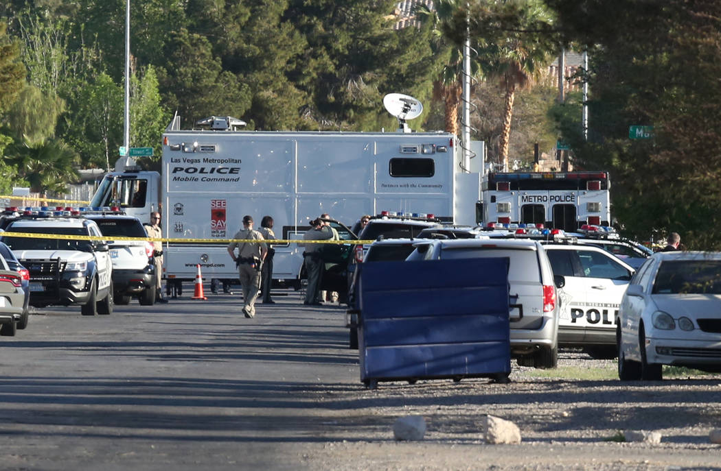 Las Vegas police investigate an officer-involved shooting at Madge Lane and Mabel Road, between Charleston Boulevard and Stewart Avenue, Friday, April 6, 2018, in Las Vegas. Bizuayehu Tesfaye/Las  ...