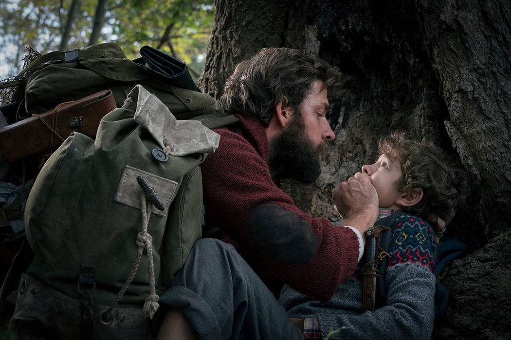 John Krasinski, left, and Noah Jupe in a scene from "A Quiet Place." (Jonny Cournoyer/Paramount Pictures via AP)
