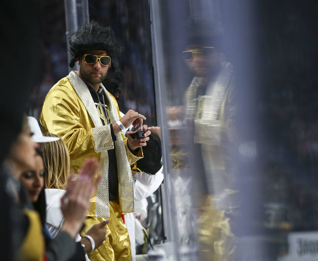 A Golden Knights fan looks on during the second period of Game 1 of an NHL hockey first-round playoff series against the Los Angeles Kings at T-Mobile Arena in Las Vegas on Wednesday, April 11, 20 ...