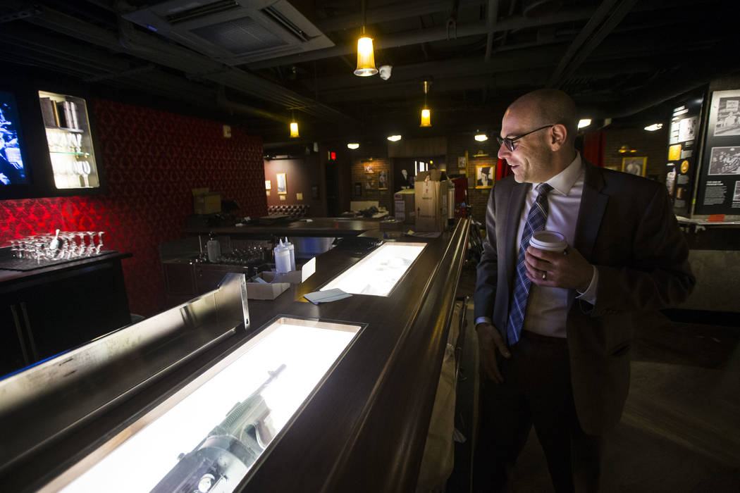 Jonathan Ullman, president and chief executive officer of The Mob Museum, looks over Prohibition-era artifacts in the speakeasy at The Underground at The Mob Museum in downtown Las Vegas on Saturd ...