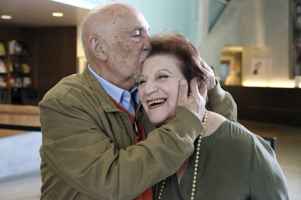 In this Wednesday, April 11, 2018, photo, childhood Holocaust survivors Simon Gronowski and Alice Gerstel Weit embrace at the Los Angeles Holocaust Museum. (Reed Saxon/AP)