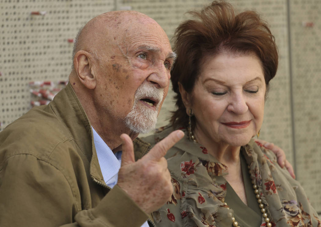 In this Wednesday, April 11, 2018, photo, childhood Holocaust survivors Simon Gronowski and Alice Gerstel Weit are interviewed at the Los Angeles Holocaust Museum memorial after their reunion afte ...