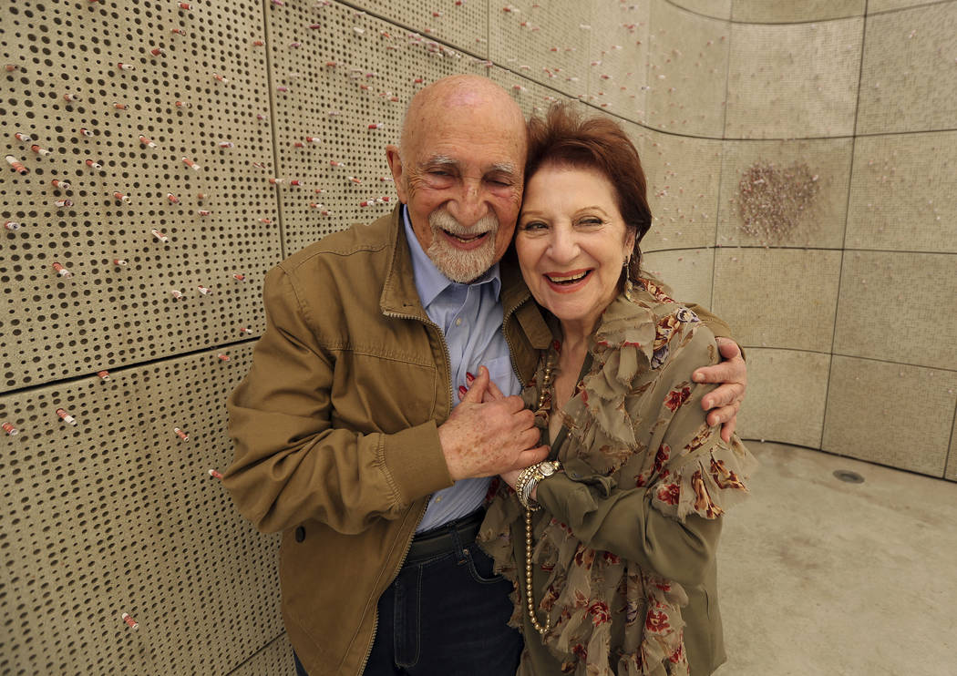 In this Wednesday, April 11, 2018, photo, childhood Holocaust survivors Simon Gronowski and Alice Gerstel Weit hug at the Los Angeles Holocaust Museum memorial. There was much hugging, kissing and ...