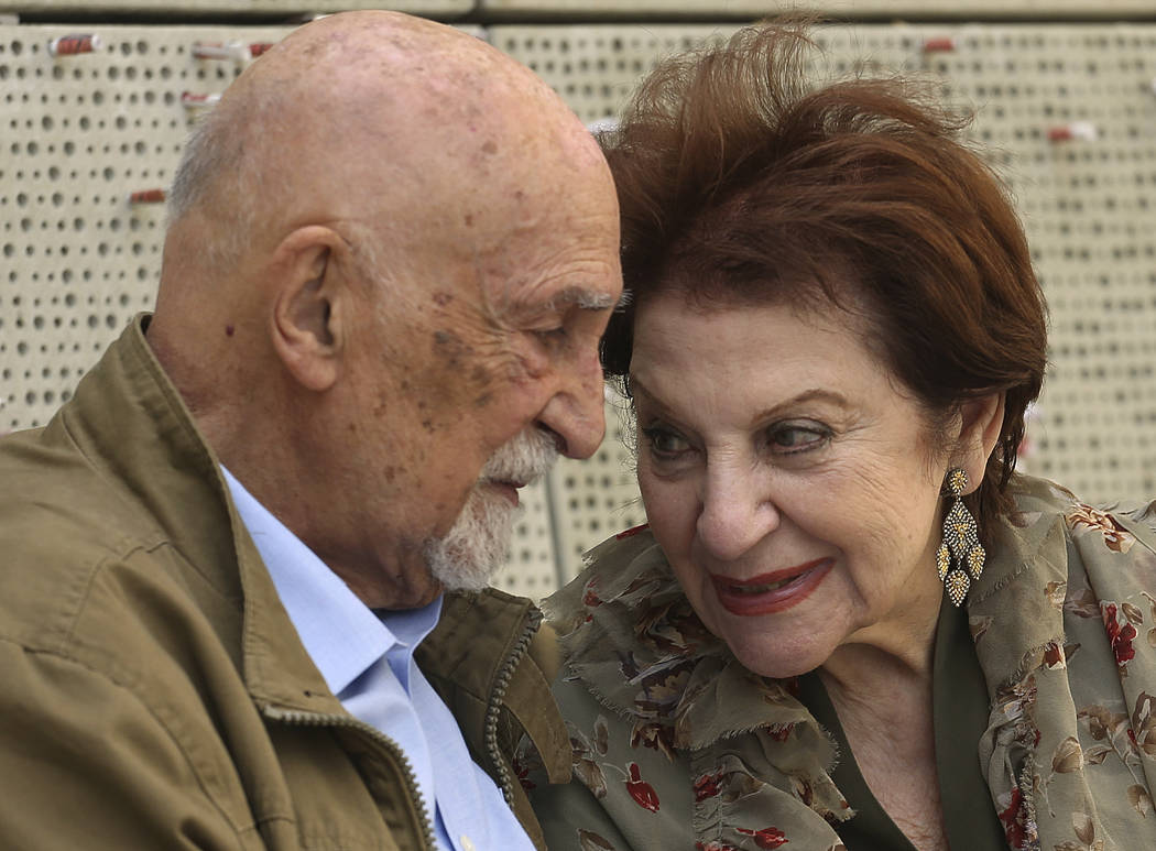 In this Wednesday, April 11, 2018, photo, childhood Holocaust survivors Simon Gronowski and Alice Gerstel Weit talk as they are interviewed at the Los Angeles Holocaust Museum, after their reunion ...