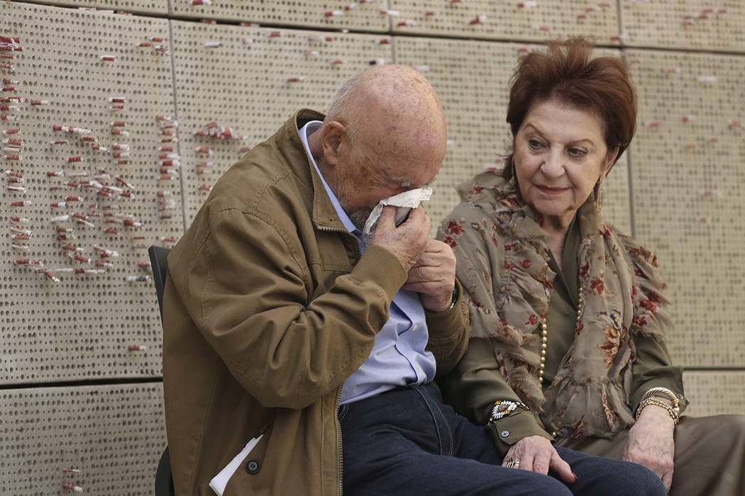 In this Wednesday, April 11, 2018, photo, childhood Holocaust survivors Simon Gronowski and Alice Gerstel Weit are interviewed at the Los Angeles Holocaust Museum memorial. (AP Photo/Reed Saxon)