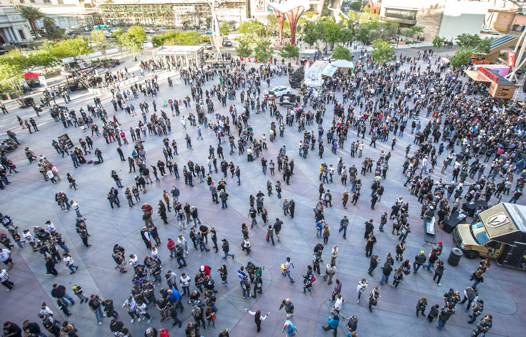 Fans gather on the patio outside T-Mobile Arena before the start of game two of the Golden Knights first round playoff series with the Los Angeles Kings at Toshiba Plaza on Friday, April 13, 2018, ...