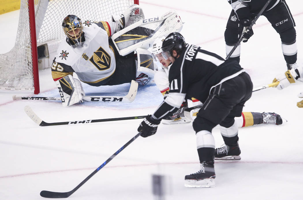 Los Angeles Kings center Anze Kopitar (11) lines up his shot as Golden Knights goaltender Marc-Andre Fleury (29) defends during the first period of Game 3 of an NHL hockey first-round playoff seri ...