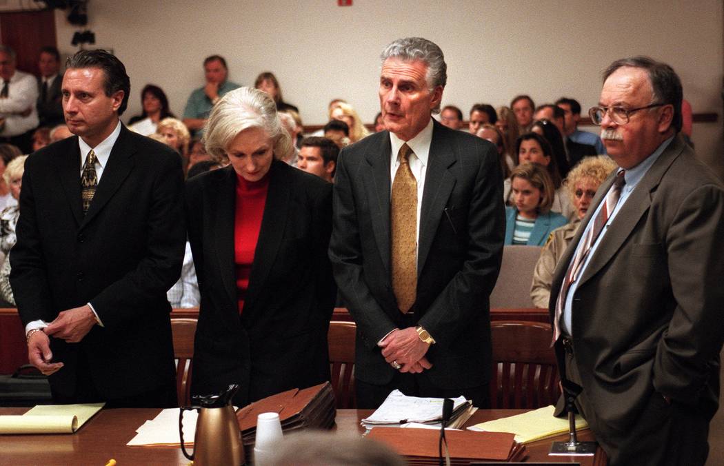 Margaret Rudin drops her head while her attorneys Michael Amador, left, John Momot and Tom Pitaro listen to the verdict in 2001. Rudin was convicted in the December 1994 murder of her husband and ...