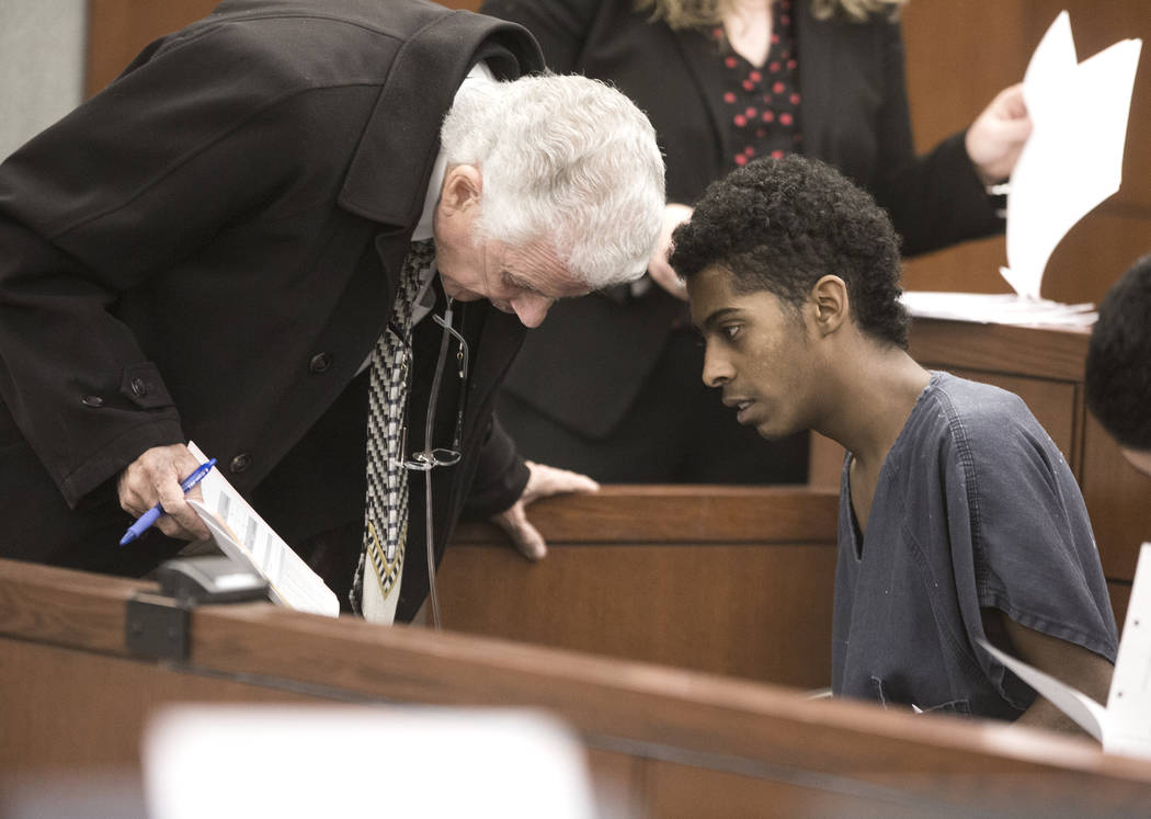 Richard Newsome, right, confers with his attorney John Momot while making his initial court appearance in 2017 at the Regional Justice Center. Newsome was found guilty fatally shooting former Chap ...